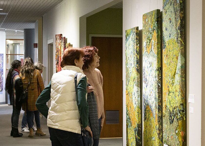women looking at art in a gallery