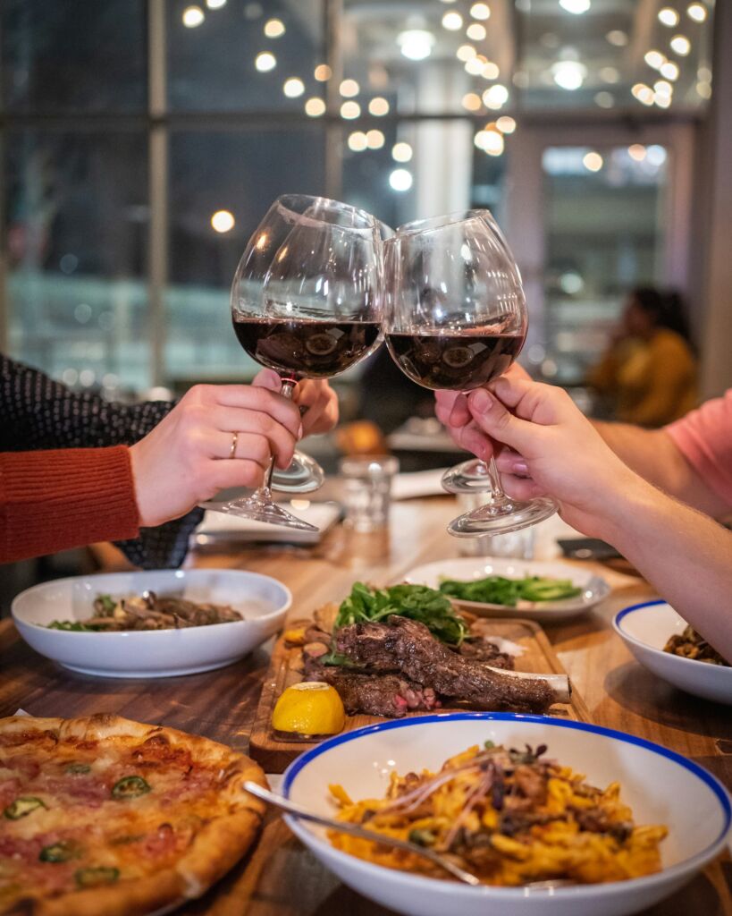 wine glasses coming together in a toast