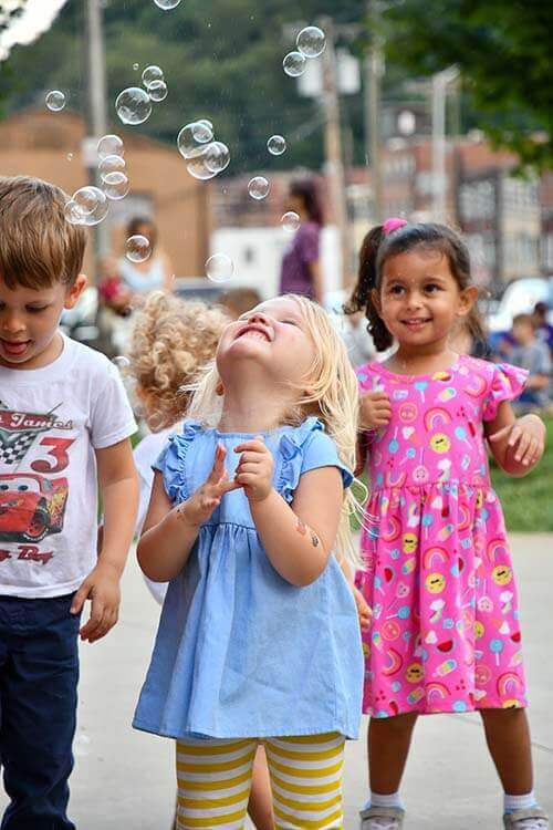 kids playing at concerts on the creek