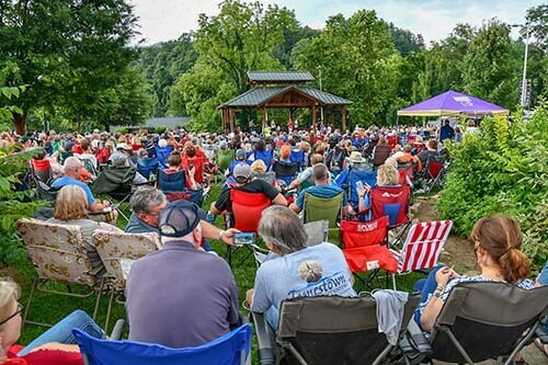 crowd of people at concerts on the creek