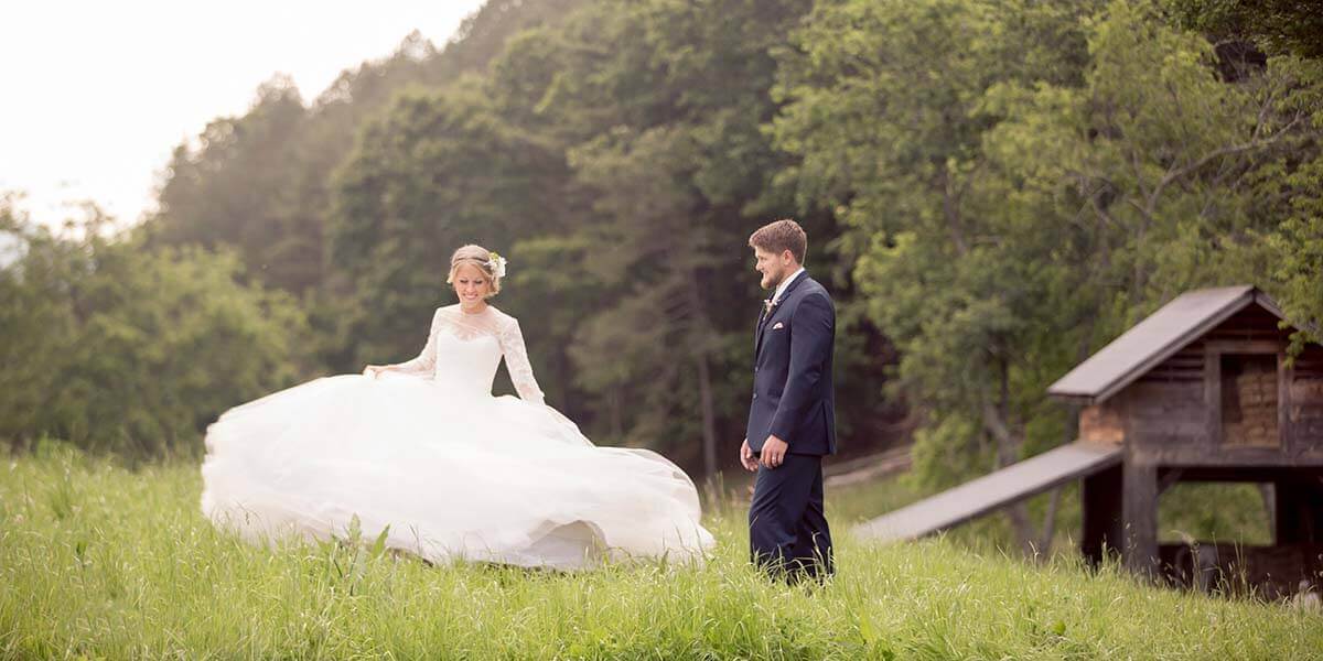 groom watching bride twirl her skirt