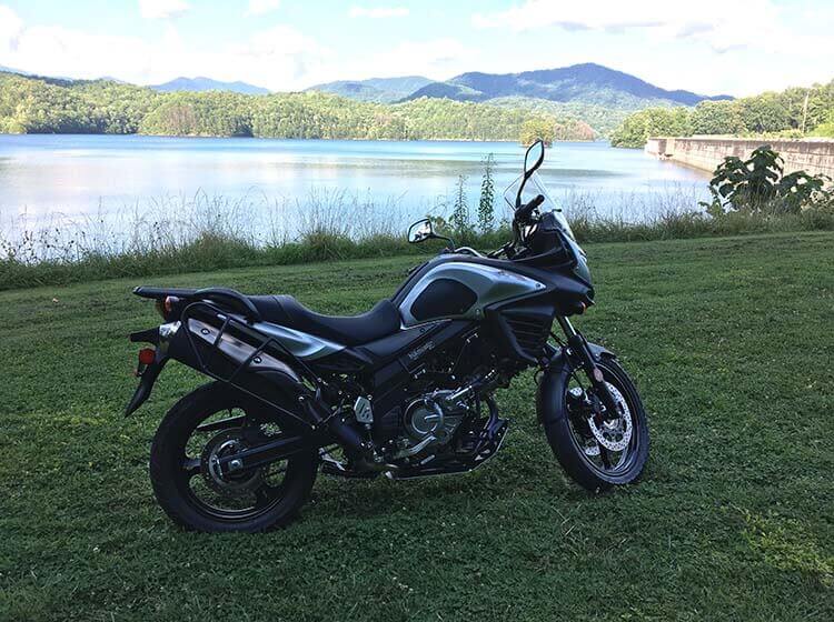 motorcycle parked by lake