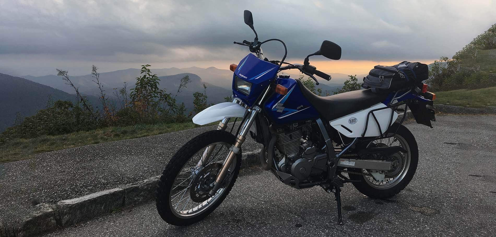motorcycle parked on scenic overlook