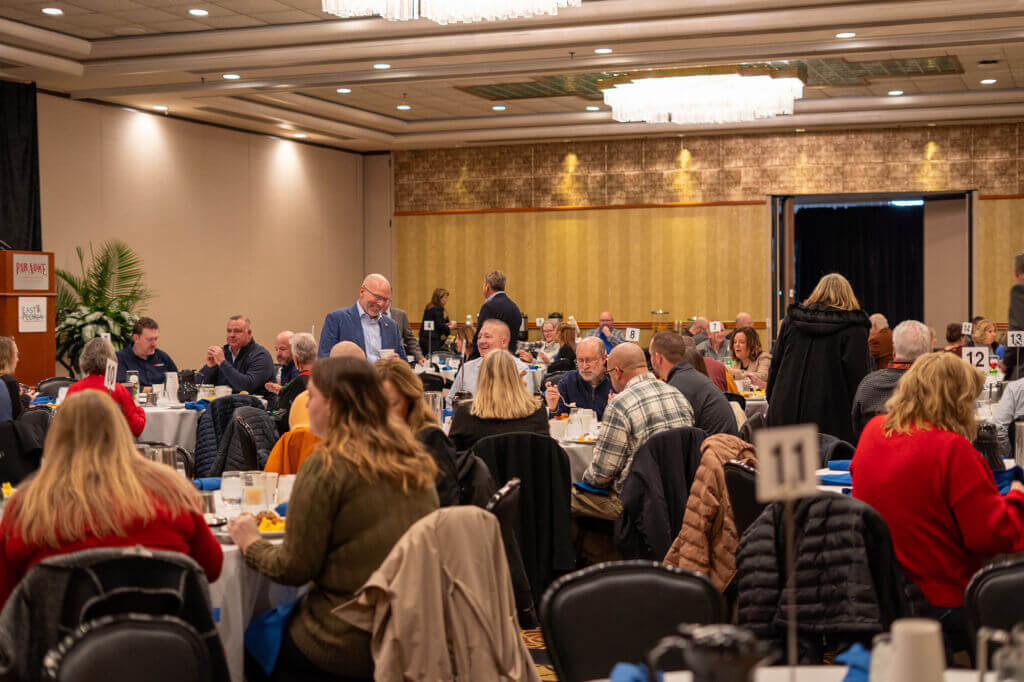 A full banquet room of attendees seated at tables during the Annual Dinner