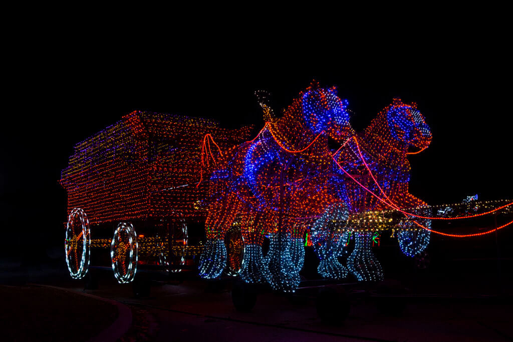 Vivid red light sculptures along the Festival of Lights drive-through display