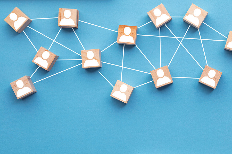 Wooden blocks connected together on a blue background.