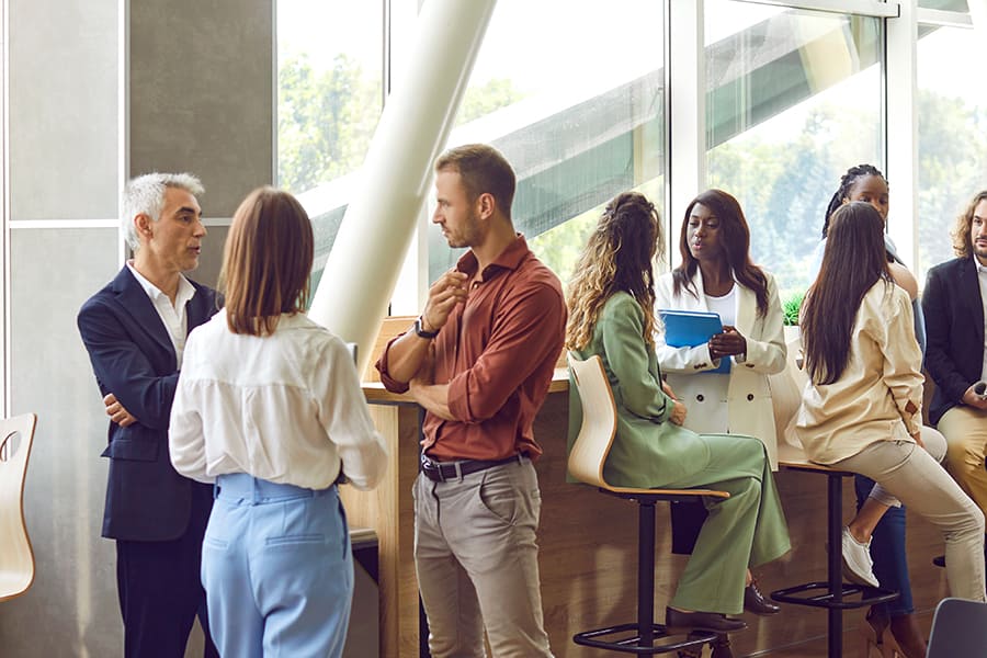 Diverse business people are communicating at a conference, seminar or other event