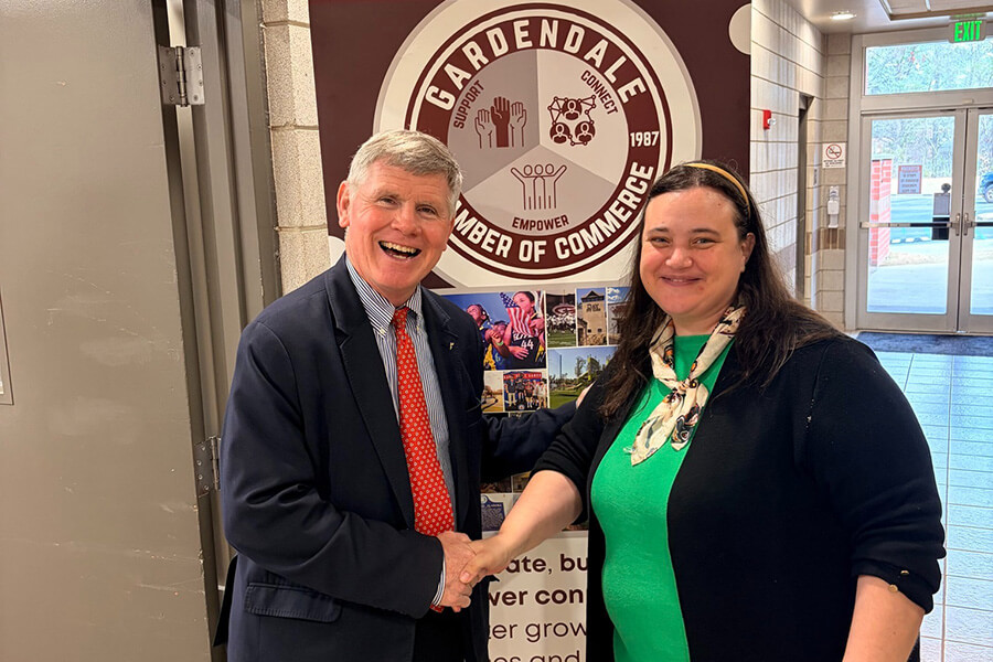 Amalia Meadows shaking hands with Gordon Stone