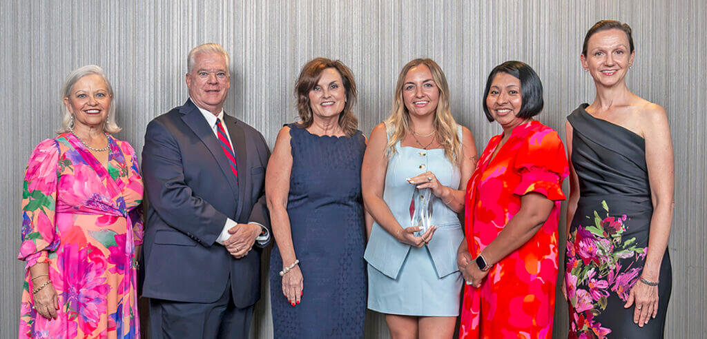 Receiving the award at the Association of Chamber of Commerce Executives (ACCE) annual conference.
Left to right: 2026 ACCE Chair Natalie English, Wilmington, N.C., Chamber of Commerce; Kevin Walker, Executive Vice President &amp; Chief Policy Officer; Overland Park Chamber President Tracey Osborne Oltjen; Izzy Hagen, Director of Marketing; Celia Byers, Senior Director of Programming &amp; Partnerships; and Sheree Anne Kelly, ACCE President &amp; CEO.