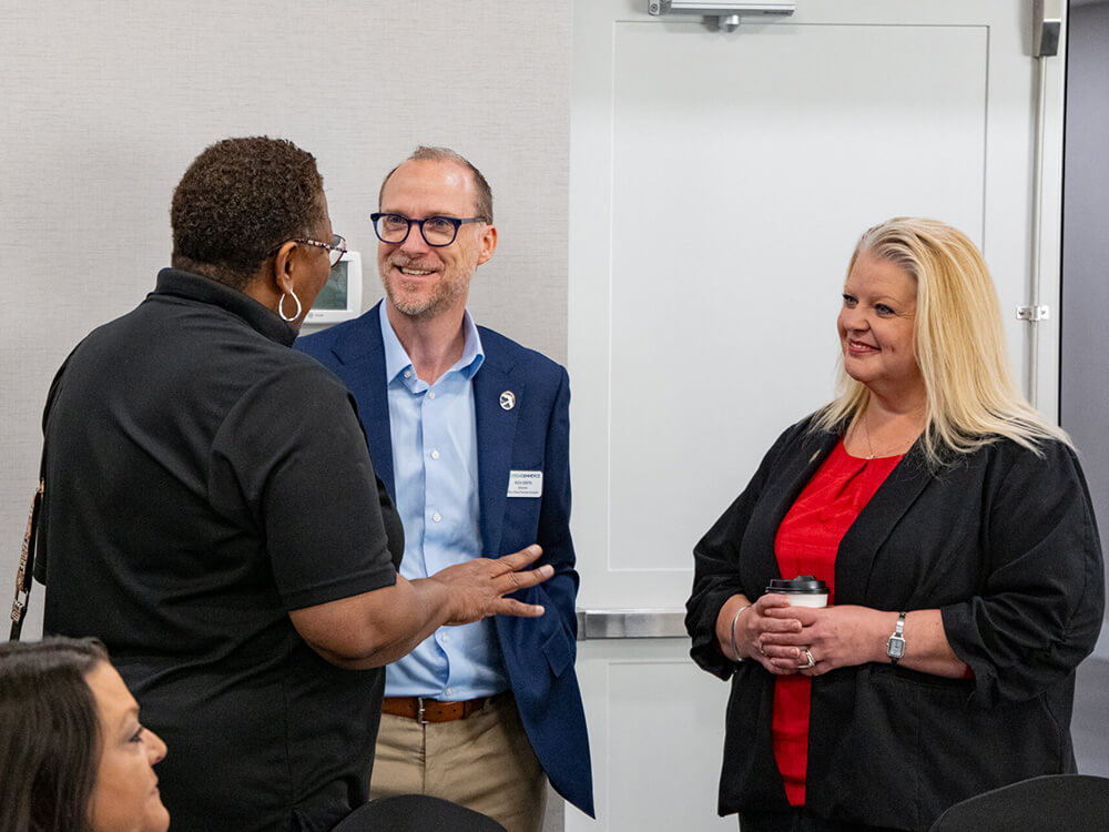 three professionals networking at event