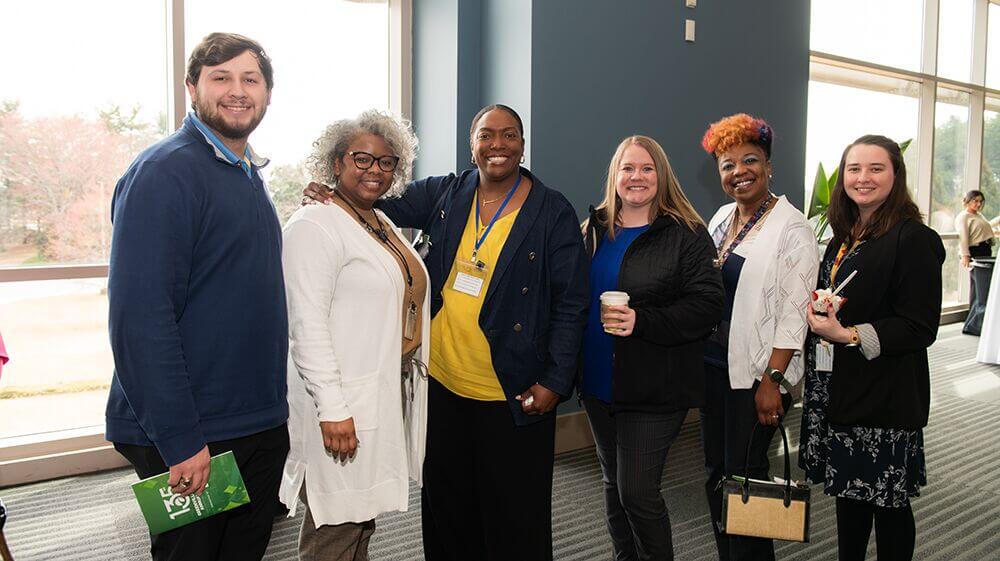 Attendees posing together at a Chamber Connect event