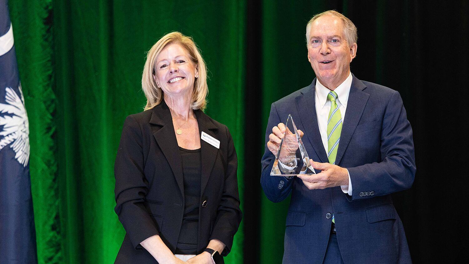 Award presentation on stage at the 2026 State of Greenville