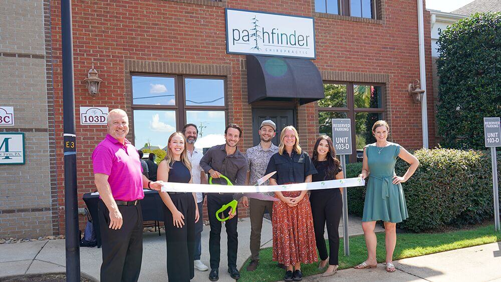Ribbon cutting outside Pathfinder Chiropractic