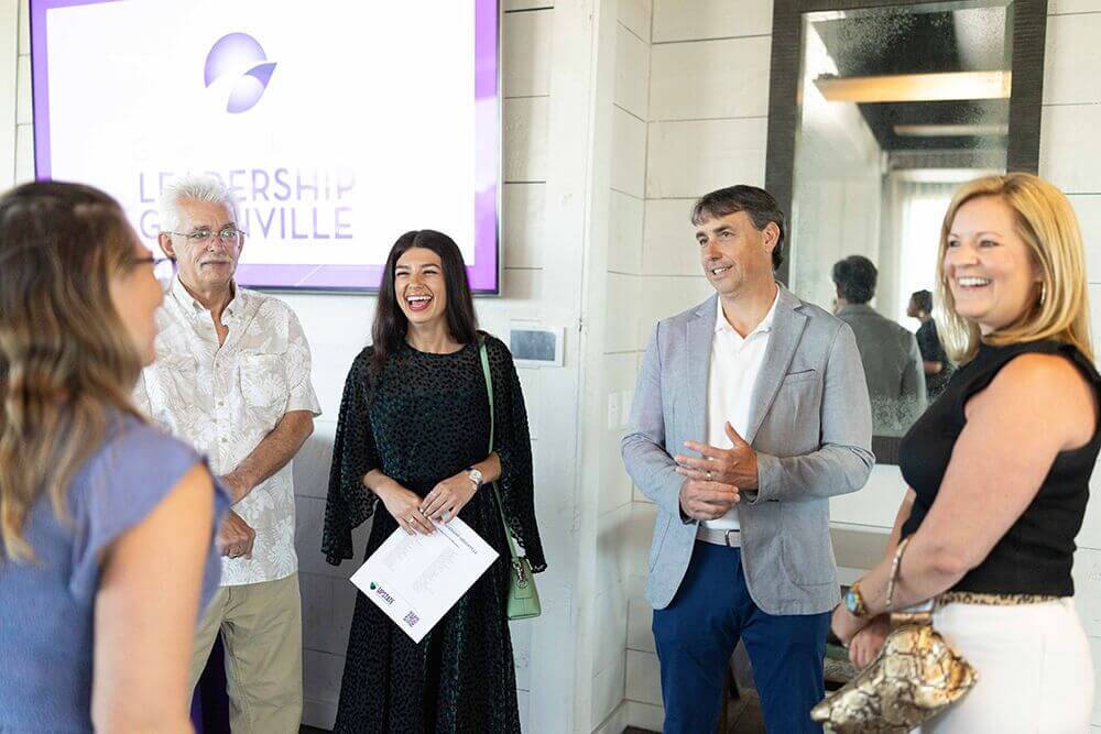Leadership Greenville graduates chatting at a graduation celebration