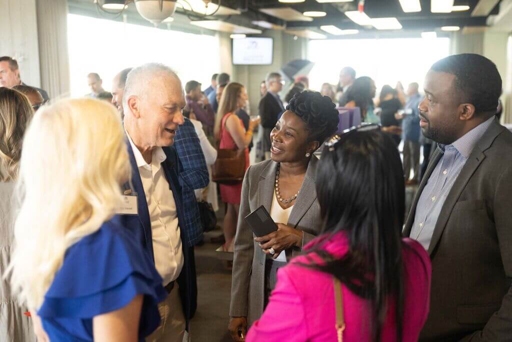 Leadership Greenville alumni mingling and greeting each other at an event