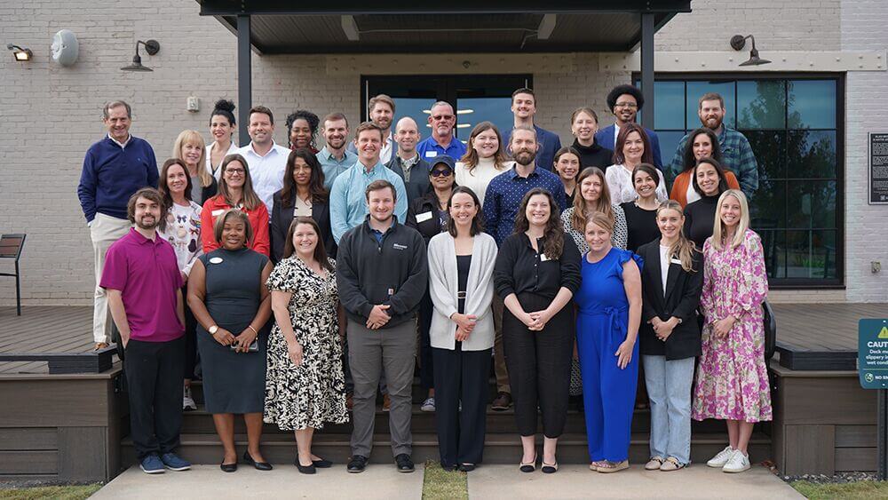 Opportunity Greenville group photo outside a building entrance