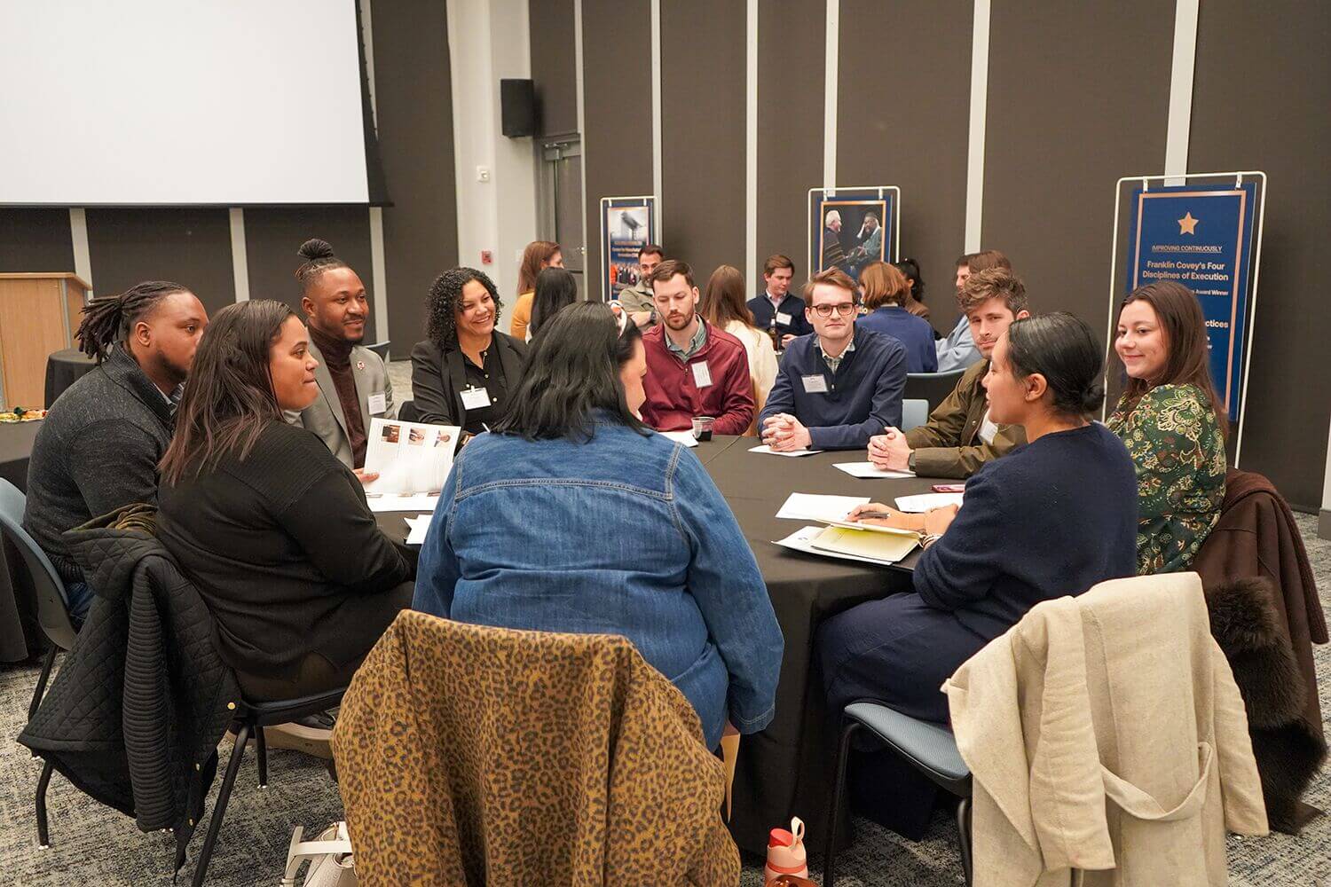 Pacesetters members in discussion at round tables