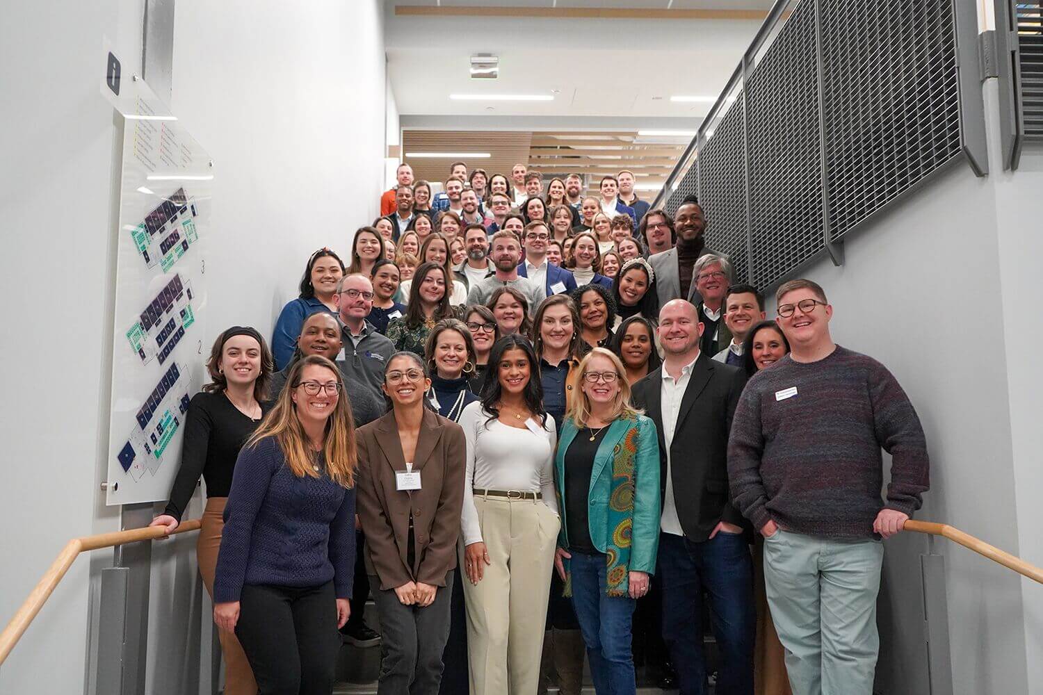 Pacesetters group photo on a staircase landing