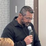 man speaking into microphone