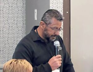 man speaking into microphone