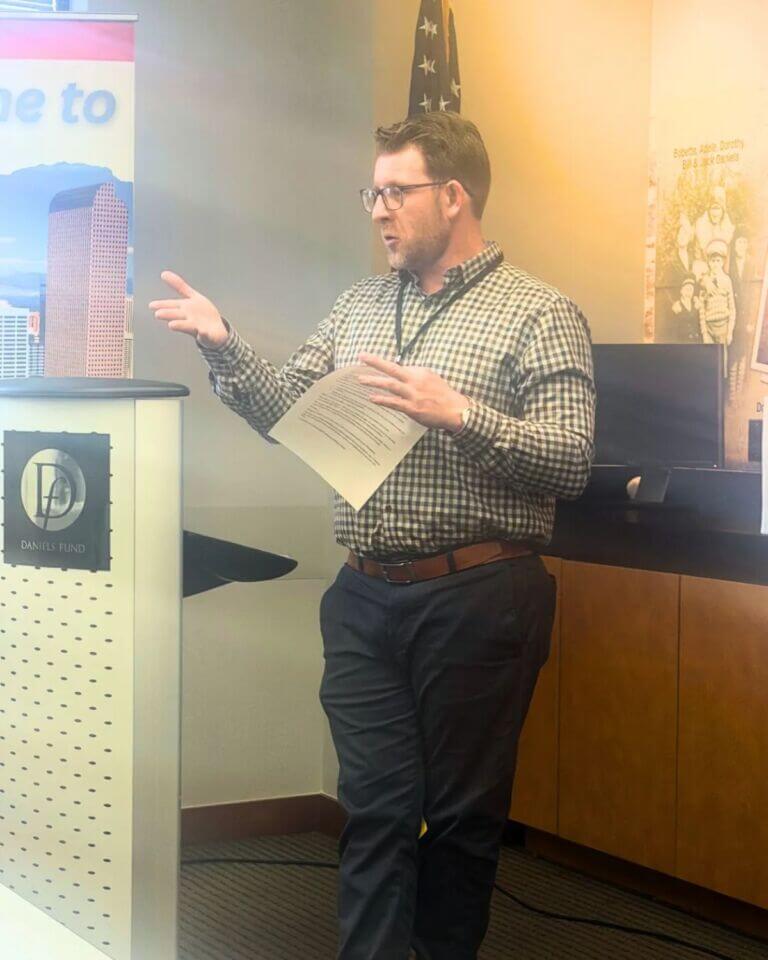 man speaking to group
