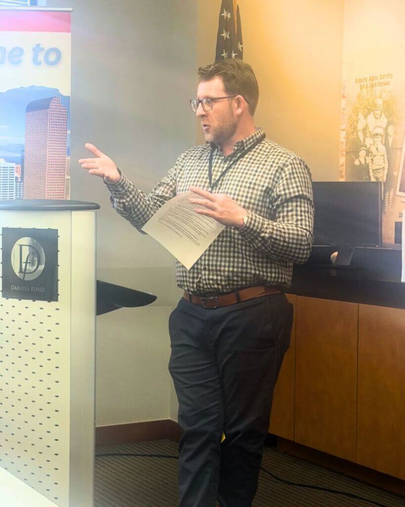man speaking to group