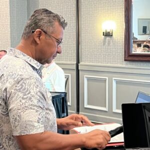 man preparing to speak at event