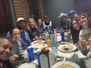 group of people at restaurant eating meal