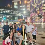 group of people in minneapolis in front of Prince mural