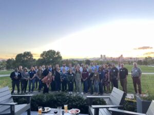 large group of IFMA Denver members taking group photo outdoors