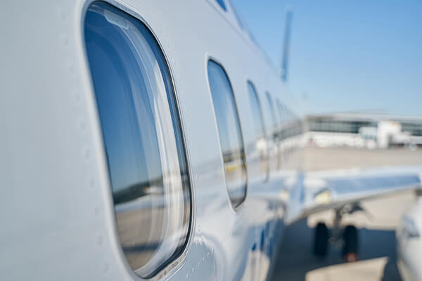 Cropped photo of a modern large commercial jetliner landed at the aerodrome on a clear day