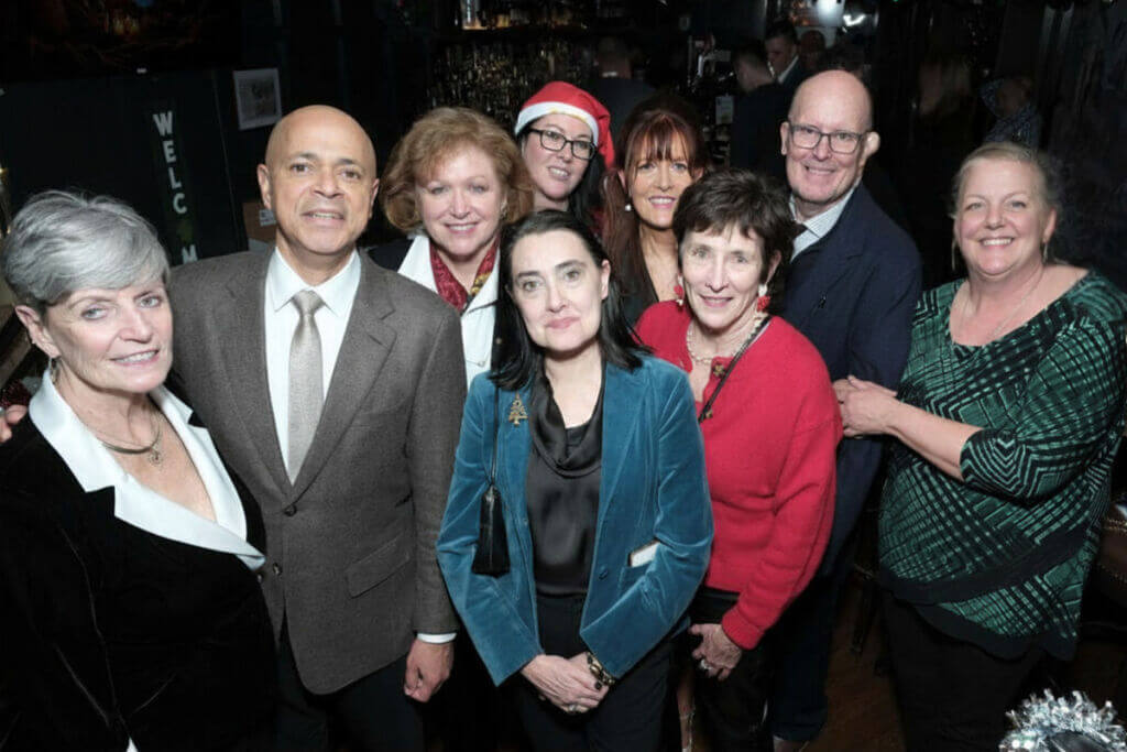 IBO members posing for a photo at an event.