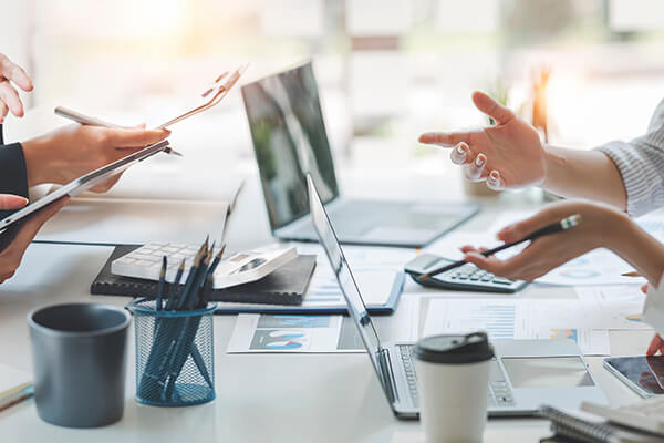 diverse coworkers working together in boardroom, brainstorming,