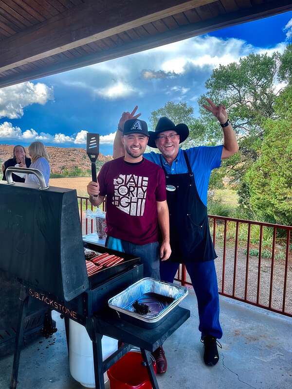 Two men grilling