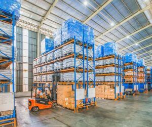 Fork lift drive in large warehouse