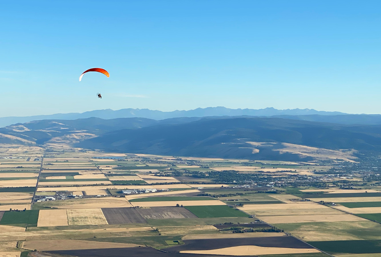 Paramotorist flying over the Grande Ronde Valley