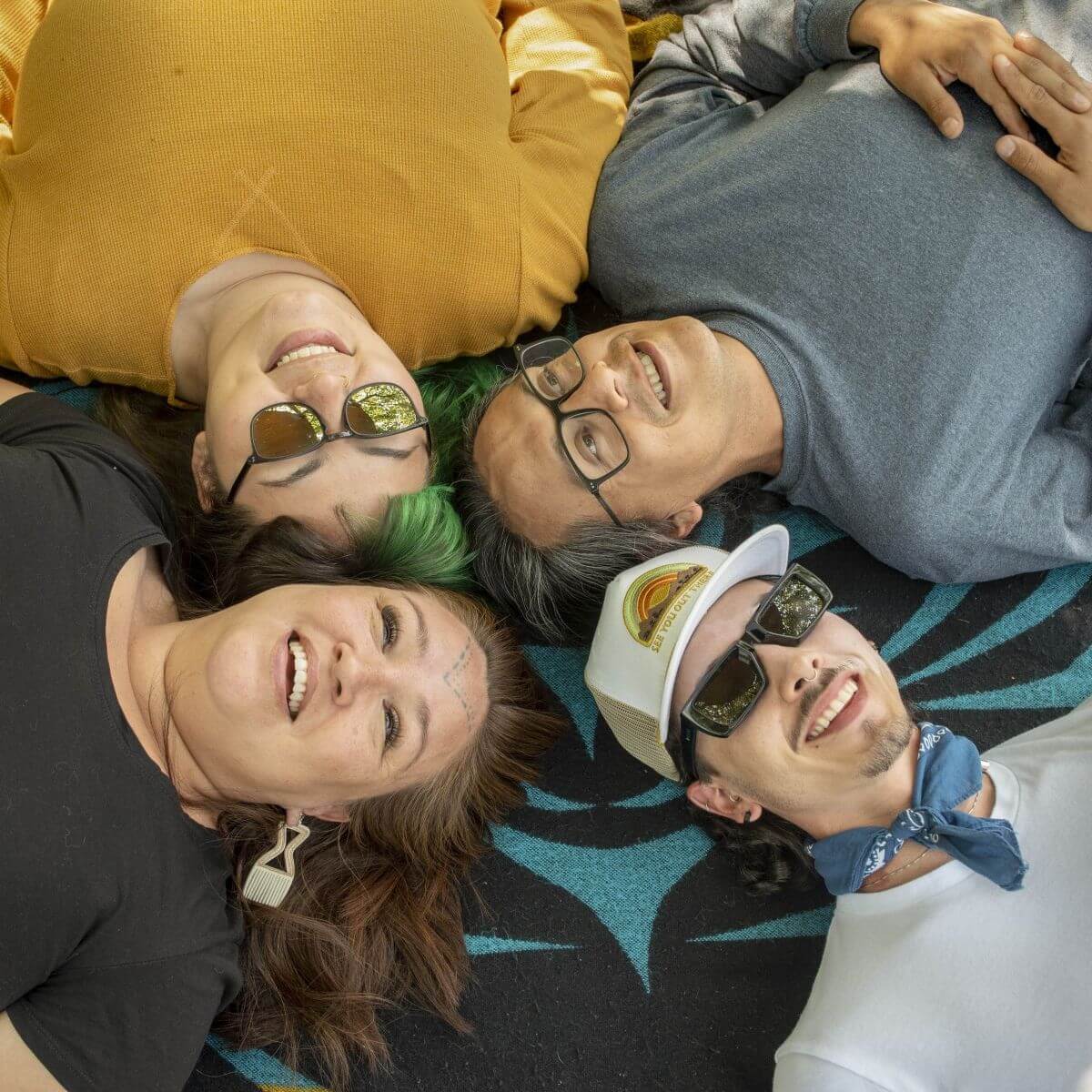 people with their heads together to represent building connected and safe communities