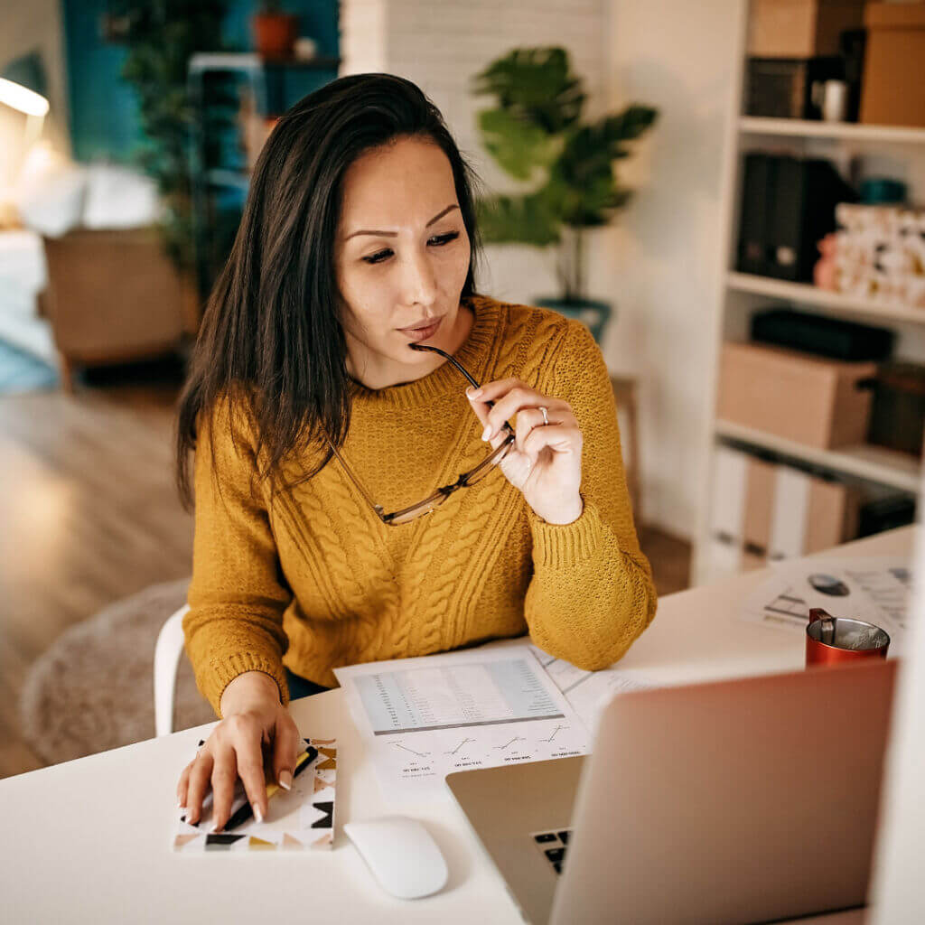 young woman working at a laptop