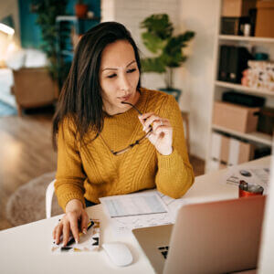 young woman working at a laptop