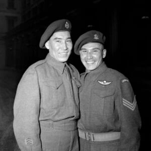 Sergeant Tommy Prince of the Brokenhead Ojibway Nation (right), MM, 1st Canadian Parachute Battalion, with his brother, Private Morris Prince, at an investiture at Buckingham Palace, London, England, February 12, 1945.