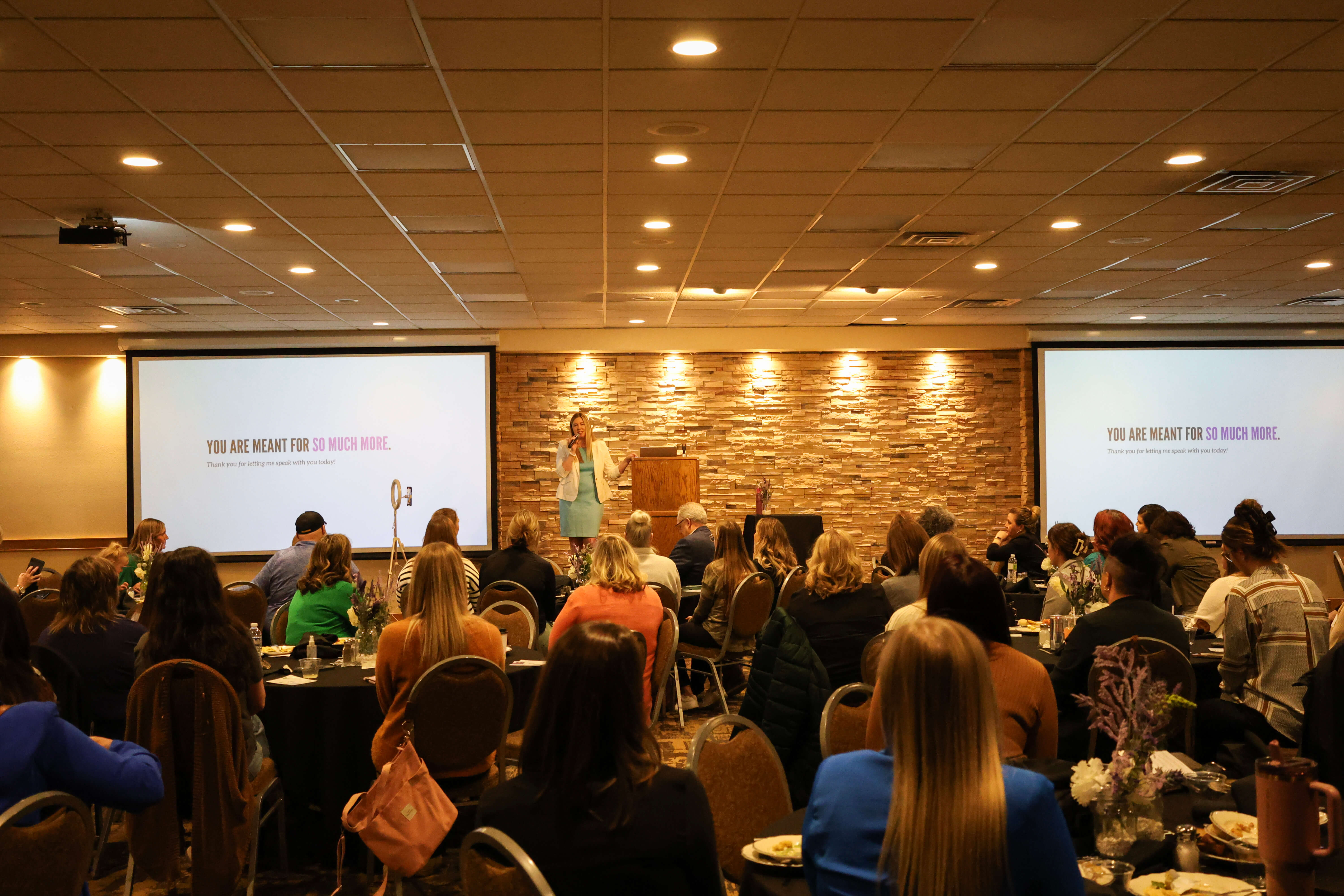 Large group of people watching a presentation