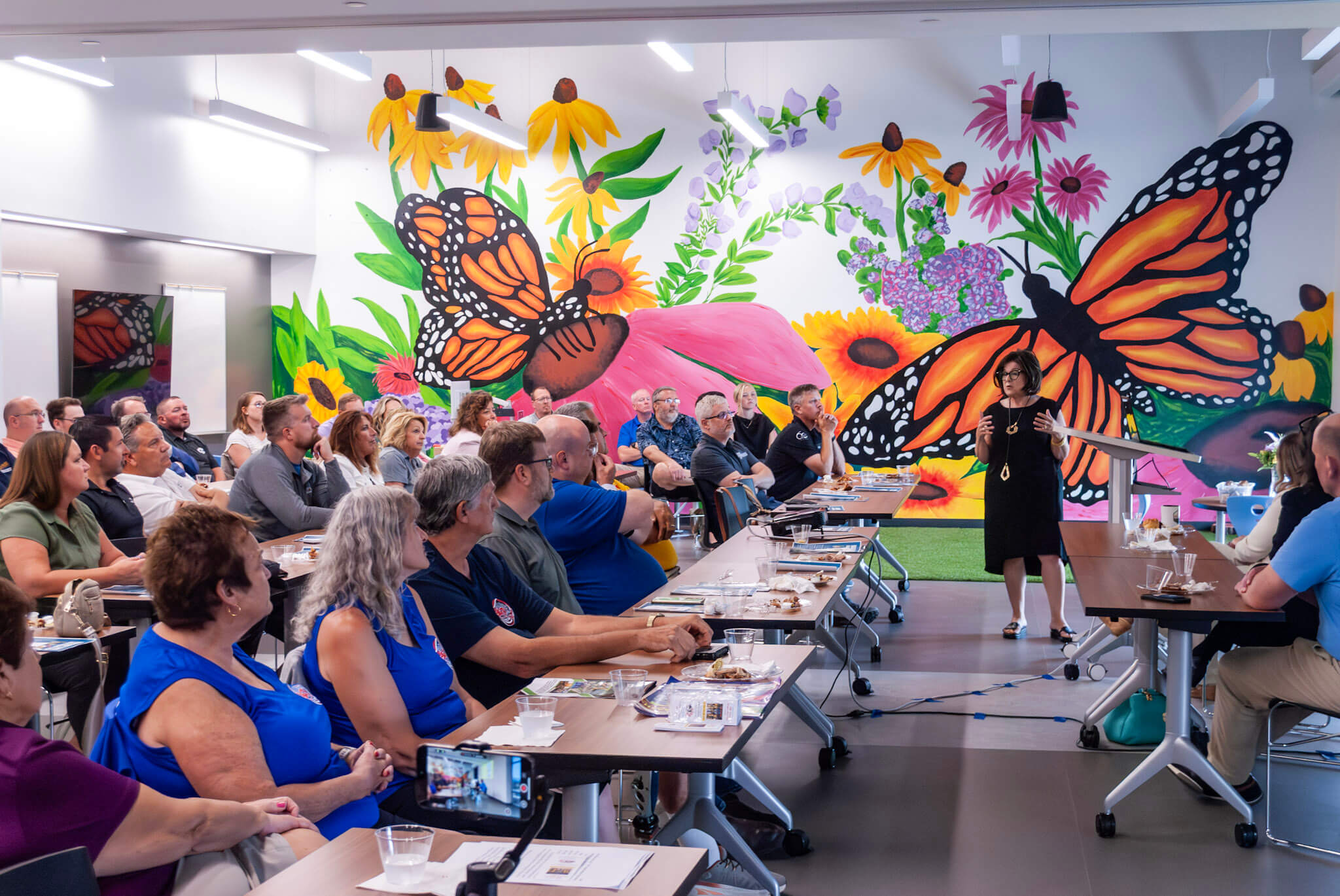 large group of people listening to a speaker