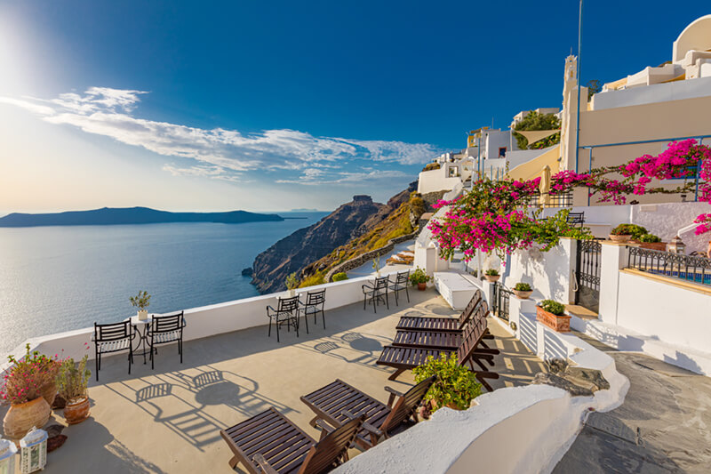 relaxing romantic view with white architecture flower santorini greece caldera view blue sea