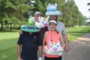 people with floaties golfing