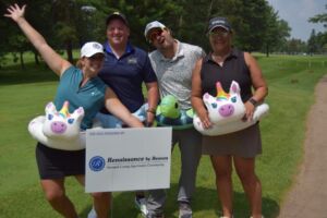 picture with golfers and sign