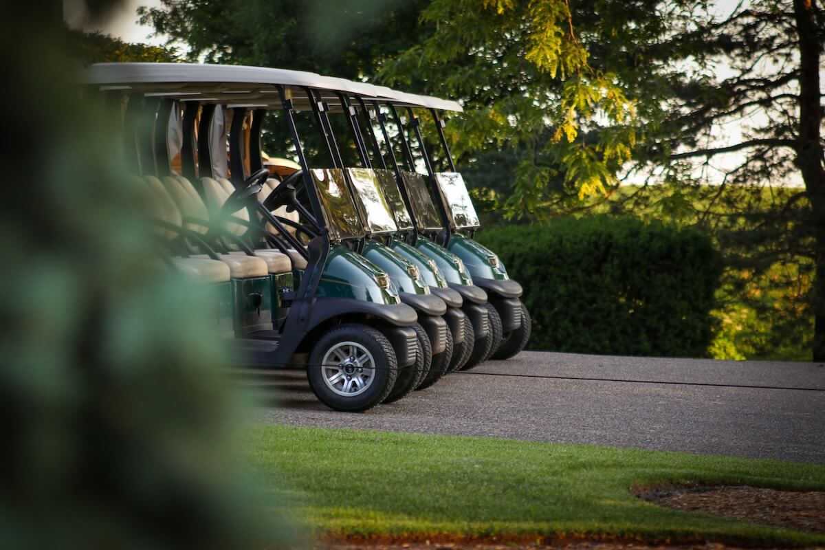 four golf carts lined up