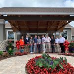 ribbon cutting event with chamber members outdoor cutting a ribbon