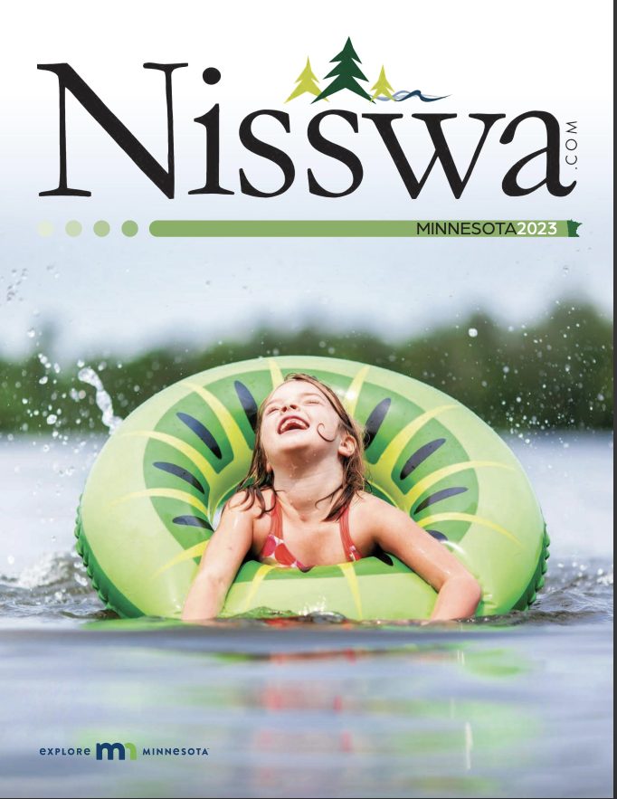 2023 Nisswa Destination Guide cover image of girl laughing in inner tube on a lake