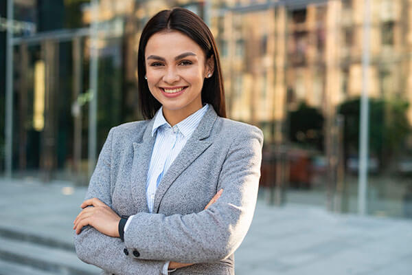 woman crossing her arms smiles