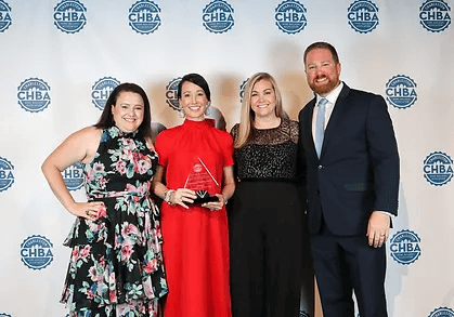 People posing with award.